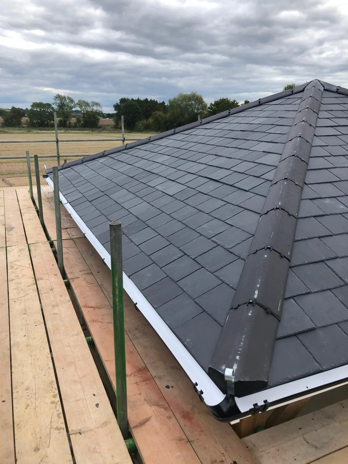New natural slate roof fitted to a garden room with countryside views