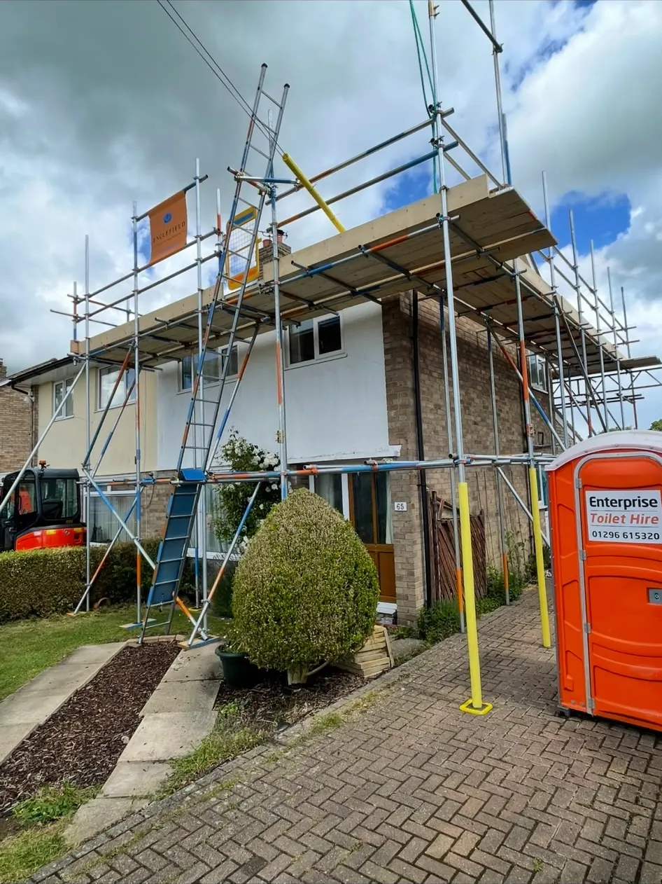 Scaffold across the front of a semi-detached house during roof works
