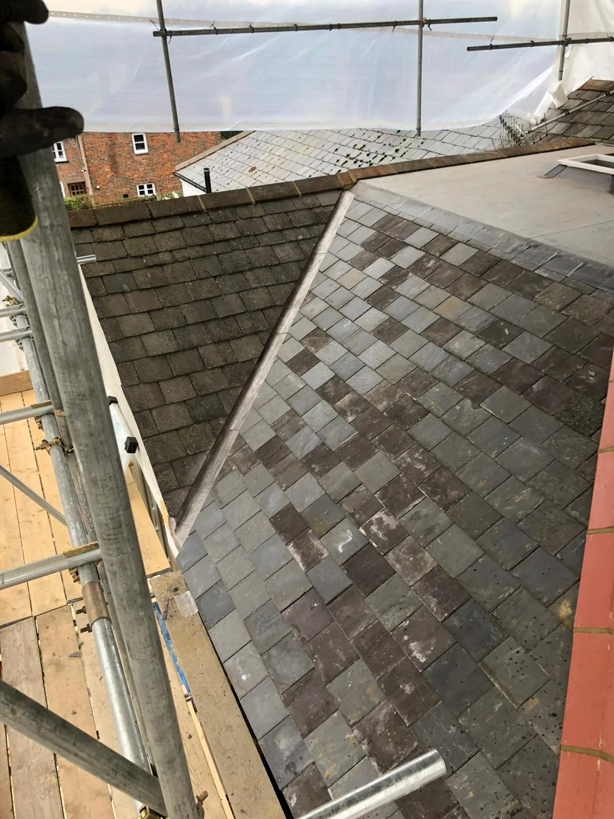 Slate roof gable viewed from scaffolding during installation